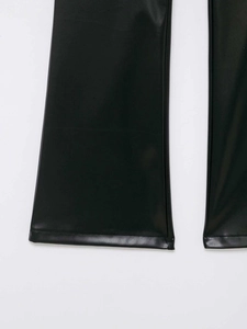 Detail of the flared hem and smooth faux leather material on these black fashion trousers