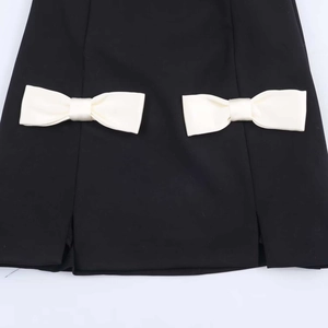 Slim fit V-neck sleeveless black dress with cream satin bows and double side slits