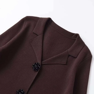Dark brown knitted blazer for women with notched lapels and decorative flower buttons