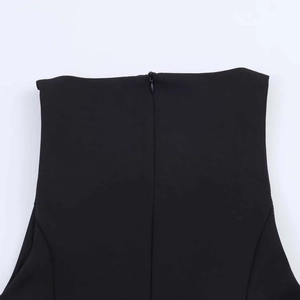 Detail of hidden back zipper on a slim-fit black sleeveless V-neck summer dress