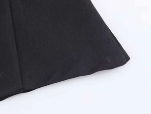 Detailed macro view of black heavy twill fabric texture and fine stitching on top