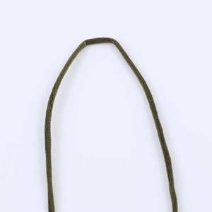 Detailed close-up of the woven thin straps on the olive green summer dress