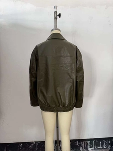 Back view of a loose-fit olive green faux leather jacket with an elasticized hem design