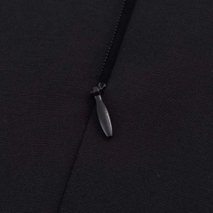 Sleeveless V-neck dress detail featuring premium invisible zipper on black woven fabric