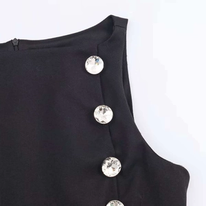 Elegant black sleeveless top with sparkling crystal buttons and concealed zipper detail