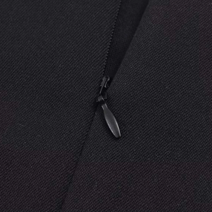 Women's black sleeveless top featuring detailed texture and a concealed zipper