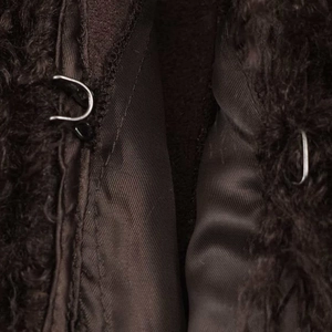 Winter dark brown faux fur jacket featuring plush texture and secure metal hook closure