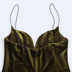 Elegant olive green velvet slip dress featuring thin straps and a central front zipper