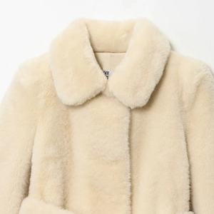 Elegant cream faux fur coat with wide lapels and soft plush texture for autumn winter wear