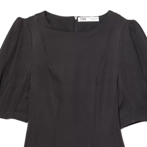 Short sleeve black puff sleeve dress with a crew neck and textured pleated fabric