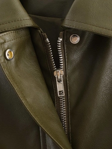 Macro detail of high-quality dark olive PU leather texture with metallic zipper and snap button
