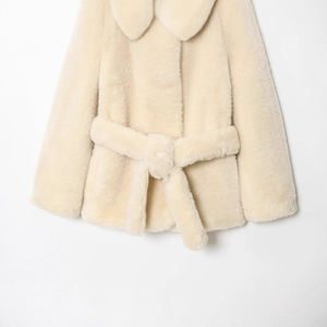 Elegant cream faux fur coat with matching waist belt and wide lapels for winter
