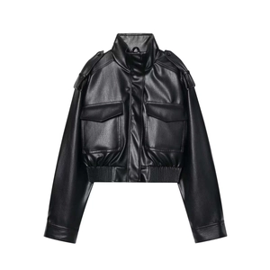 Detail of vintage black faux leather cropped jacket with epaulettes and large chest pockets