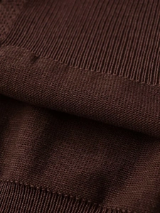 Macro view of deep brown knitted cardigan showing premium ribbed edge texture and soft fabric
