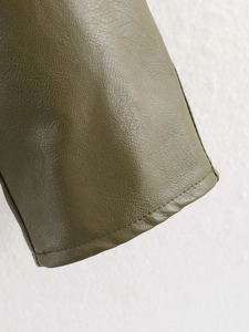 Detail of army green PU leather texture with fine grain and precision stitching finish
