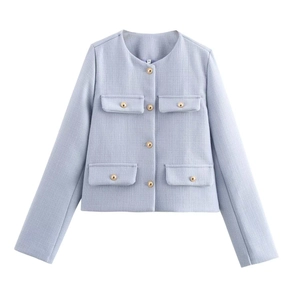 Macro shot of light blue tweed jacket texture and golden embossed buttons for women