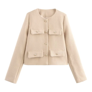 Close-up of beige tweed jacket with four flap pockets and gold metallic buttons