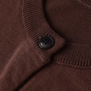 Vintage dark brown short sleeve knit cardigan with ribbed collar and black button detail