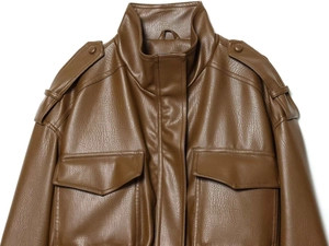 Detail view of brown faux leather jacket featuring stand collar and metal button epaulettes
