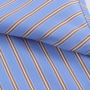 Macro shot of breathable blue and brown striped cotton fabric with fine twill texture