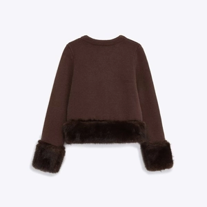 Women's dark brown knit top with plush faux fur trim on sleeves and hemline
