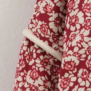 Women's floral print quilted cotton jacket in deep red with white flower patterns