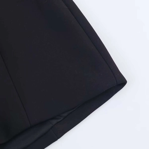 Close-up of premium black woven fabric texture and high-quality hem stitching detail