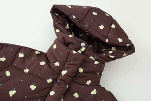 Close-up of winter floral hooded cotton jacket with metallic snap and windproof fabric