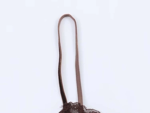 Detailed close-up of dark brown lace trim and elastic strap on a velvet camisole top