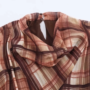 Elegant plaid high neck chiffon dress showing back button closure and collar details