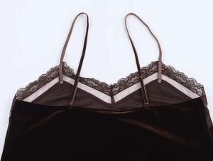 Detailed view of dark brown velvet camisole with delicate lace trim and thin straps