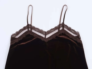 Close-up of deep brown velvet camisole with delicate lace trim and v-neck detail