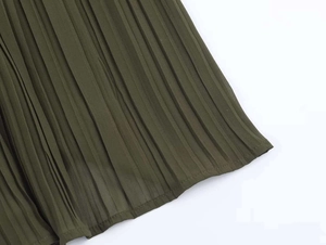Detail shot of olive green pleated midi dress fabric with fine vertical accordion pleats