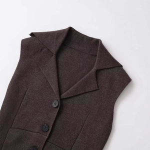 Dark brown tailored vest with notch lapels and textured fabric for professional women