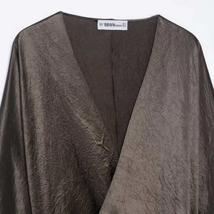 Women's V-neck pleated satin dress in bronze with elegant waist tie and shimmering finish