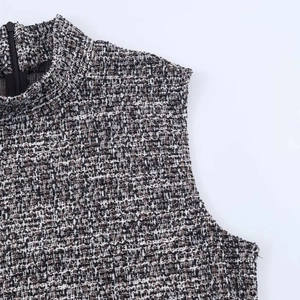 Detail of tweed dress showing high neckline and invisible back zipper closure