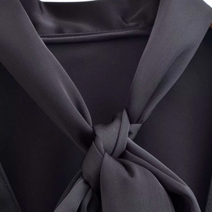 Elegant black satin blouse with a sophisticated pussy-bow tie neckline and silky texture