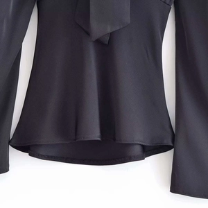 Elegant black long sleeve satin blouse featuring a bow tie collar and silky finish