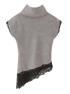 Detail of houndstooth sleeveless top with lace trim and asymmetrical hem design