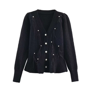 Women's black V-neck knit cardigan with pearl buttons and feather trim accents