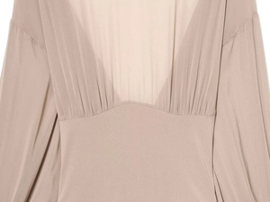Detailed view of nude pleated high neck bodysuit with elegant draped fabric texture