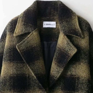 Retro yellow and black plaid wool coat with classic notched lapels and thick texture