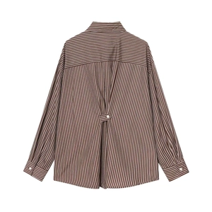 Detailed back view of striped cotton shirt featuring rear pleats and button strap detail