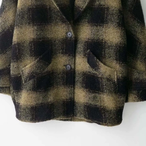 Vintage dark green and black plaid wool coat with front buttons and side pockets