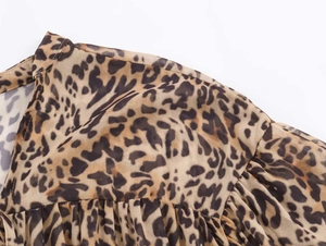 Detail of leopard print dress showing pleated shoulder seams and stitching quality