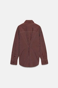 Detail of burgundy and black striped shirt featuring unique V-pleat back and adjustment strap