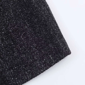 Detail of black fabric with woven silver metallic threads and sparkling texture