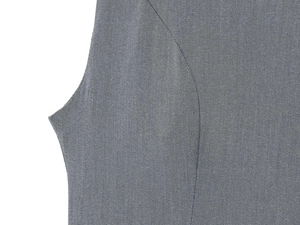 Detailed view of the medium grey fabric texture and curved side seam on the summer dress
