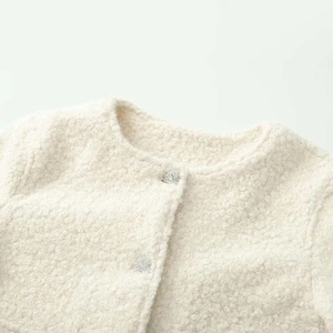 Elegant cream tweed jacket with round neck and decorative silver buttons for women