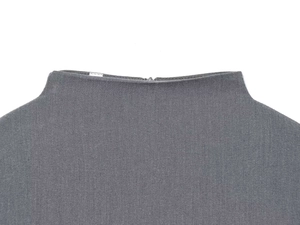 Detailed view of the boat neckline with a concealed back zipper on a grey dress